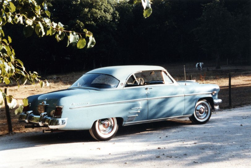 Having just seen Delworthio's photo of a blue Mercury, I couldn't resist posting one of my 1954 Monterey, some twenty years later (1989) and a few thousand miles east of Indiana. View full size.
