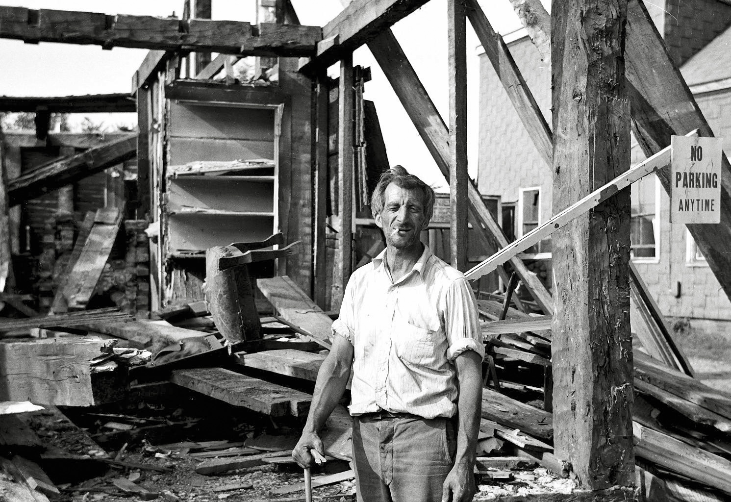 A man obviously proud of, well being in wreckage I suppose. From my negatives collection. View full size.