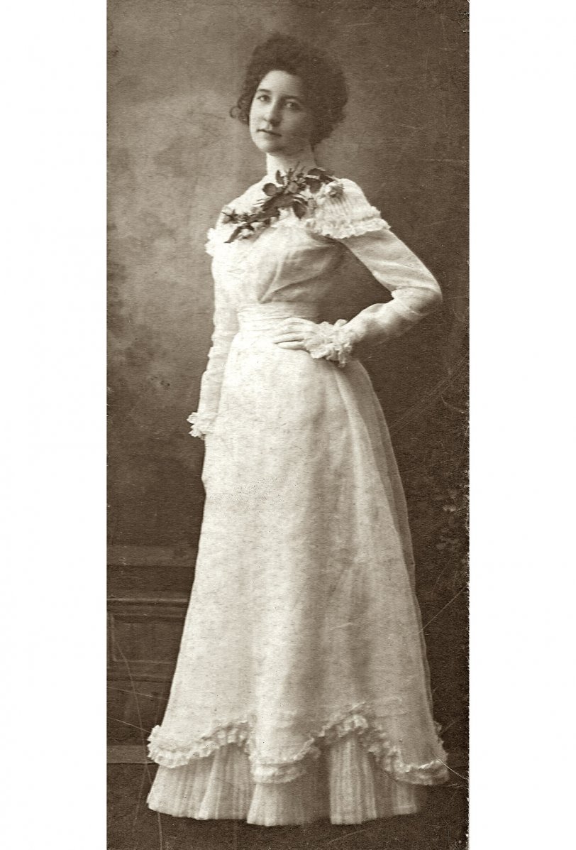I acquired this photo from my grandmother. She inherited a large box of old photos of family and friends from her much older brother. On the back is written "Nettie Duckworth, Lonaconing, Md. Became Mrs. John R. Hamilton, Thursday, Sept. 4, 1902." Lovely dress and lovely young woman.
