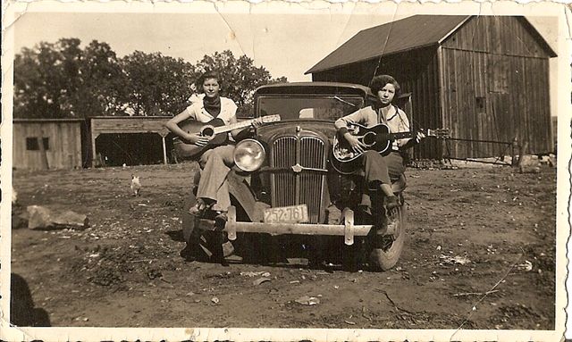 Two Milk Maids entertaining the chickens near LaCrosse, Wis., in the 1930s 
