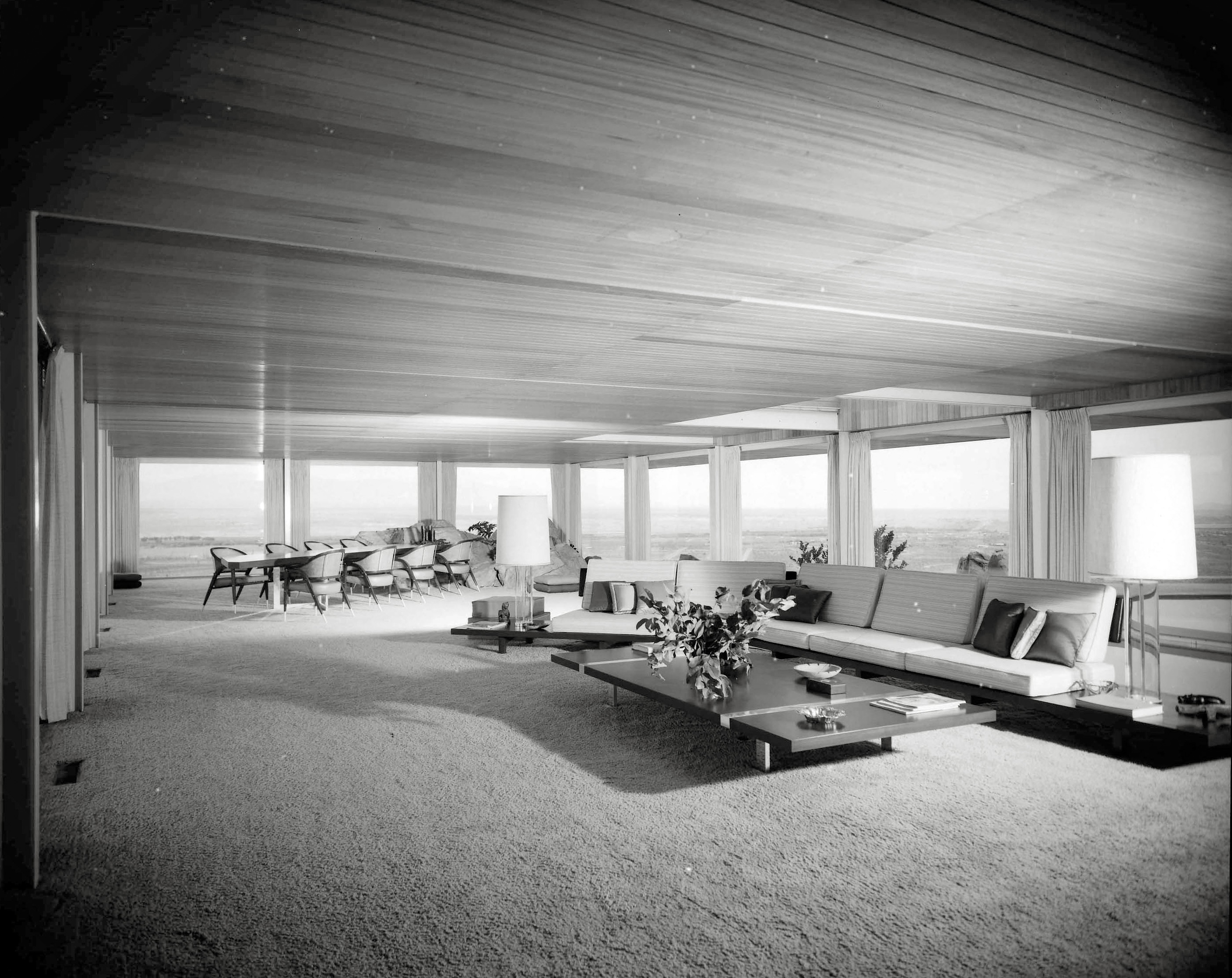 October 1960. Apple Valley, California. "Hilltop House. Newton T. Bass residence, living room. Francisco Artigas, architect." Besides the view, the focal point of this room seems to be a conference table colliding with an iceberg. From photos by Maynard L. Parker for Pictorial California and House Beautiful ("Look What's Happening to Showers!"). Source: Huntington Library. View full size.