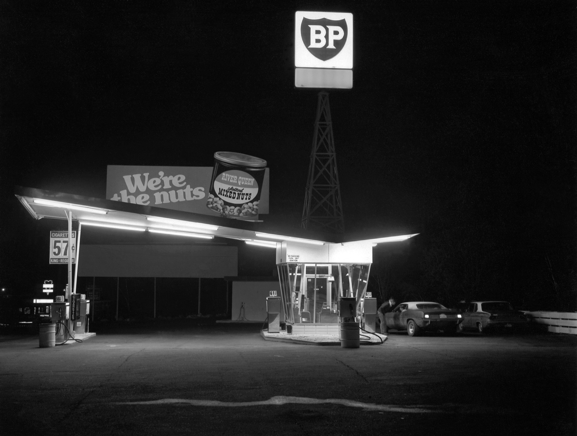 It was a warm late September night on Route 1 near Saugus, Mass., sometime around 1977. Smokes were 57 cents and gas was 56. Taken for a photography class with a 4x5 view camera. View full size.