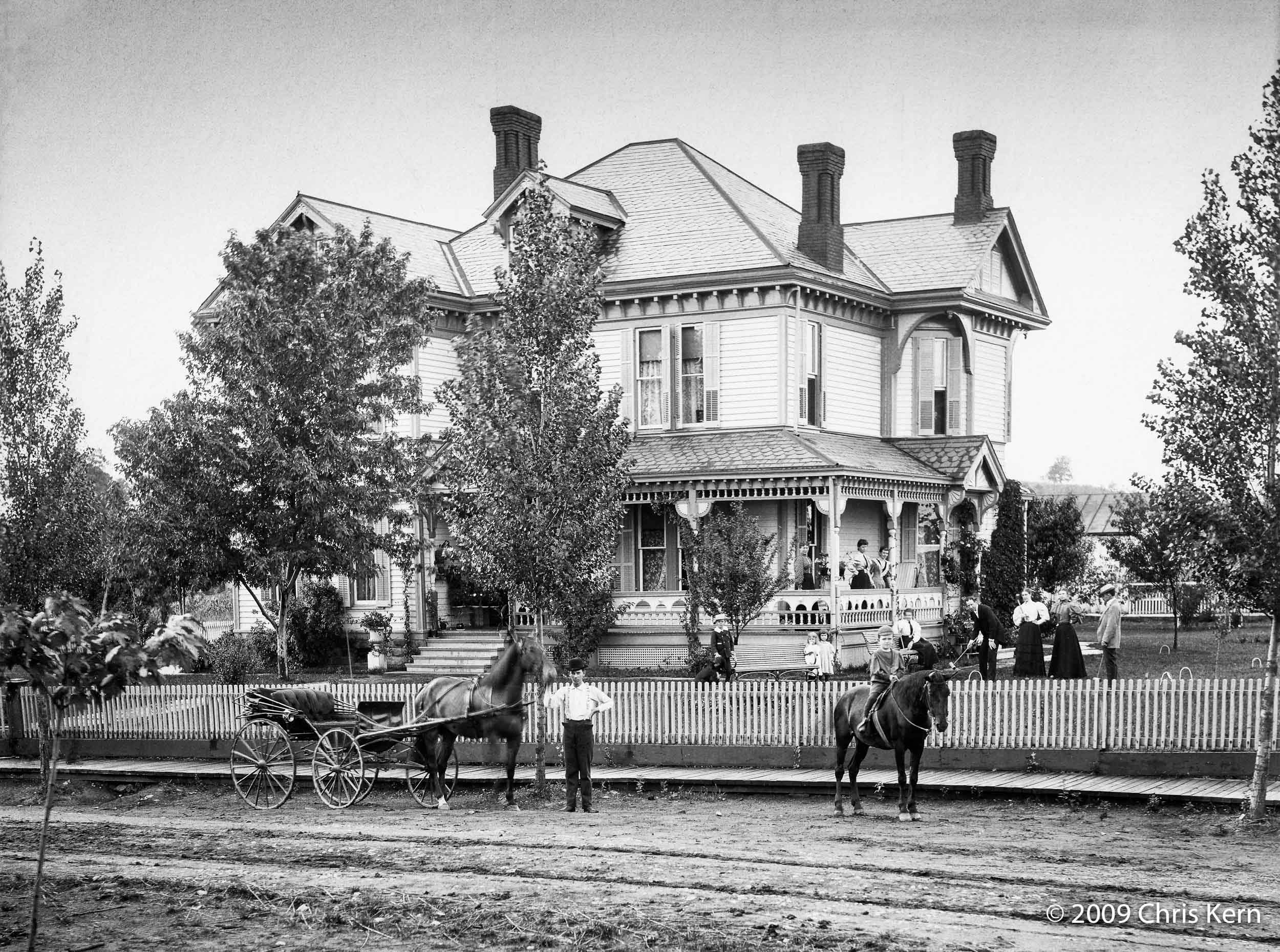 My mother referred to the house where her mother grew up as "the old Woodsfield House."  This photo dates from 1895.  The structure still stands (in slightly altered form) at 224 Eastern Ave., Woodsfield, Ohio — although I suspect the street number had not been assigned when the picture was taken.  It was known then, and apparently still is, at least among older residents of Woodsfield, as "the Mallory house."

The little blond girl standing in front of the porch and sucking her thumb is my maternal grandmother, Gertrude Mallory Messner (1892-1975).  The dapper croquet player in the hat is my great-grandfather, Wickliffe Ewing Mallory (1852-1911), a successful lawyer who built the house and went by his initials, "W.E." View full size.