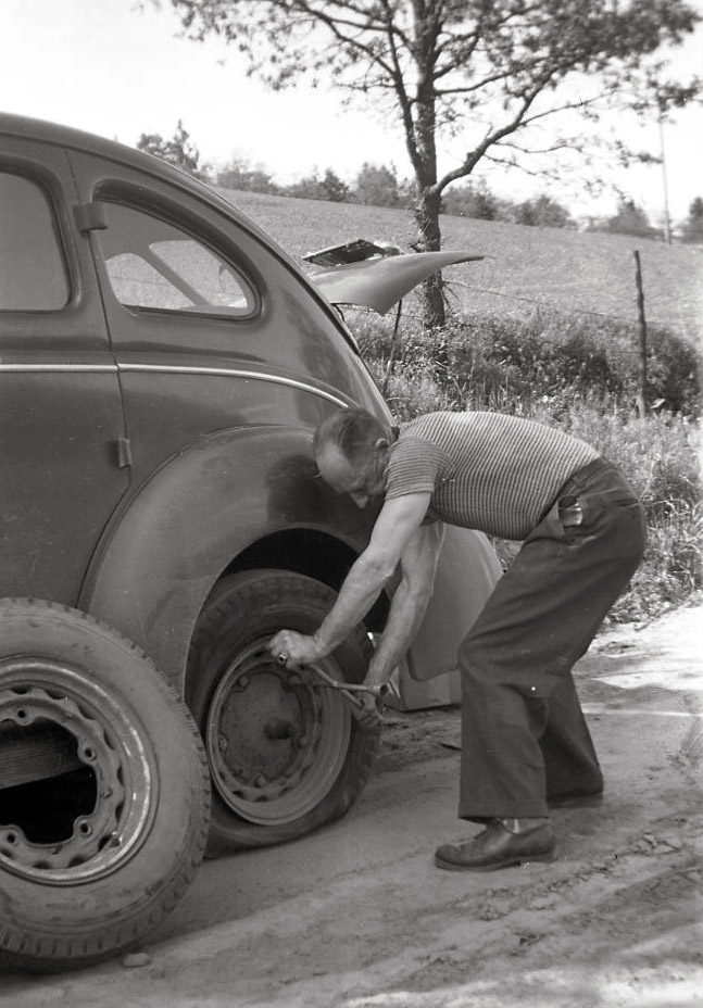 Grandpa Tom Boothby loved his cars. I guess back then they didn't have AAA. View full size.