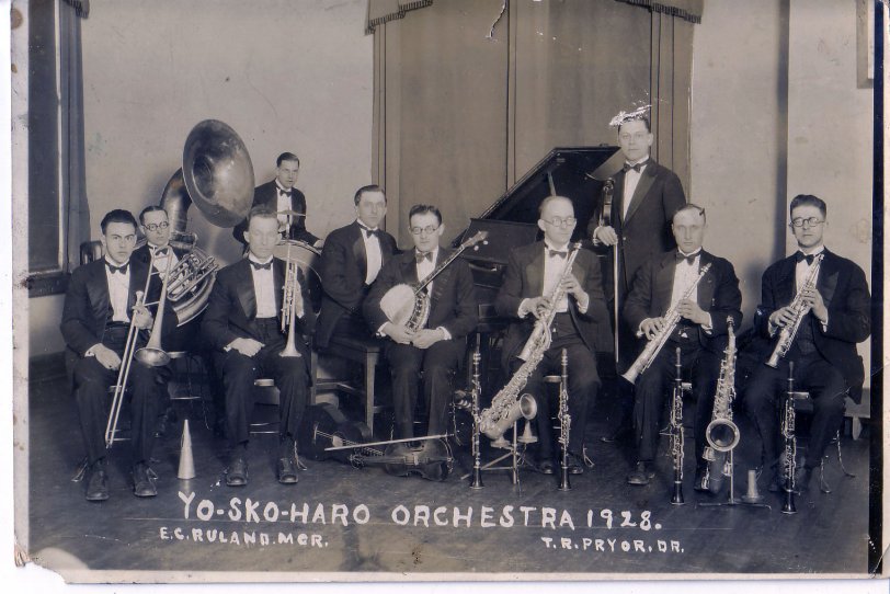 My father played the sousaphone in this picture but he played several instruments. I used to curl up inside this horn and toot. I must have driven my parents nuts. View full size.
