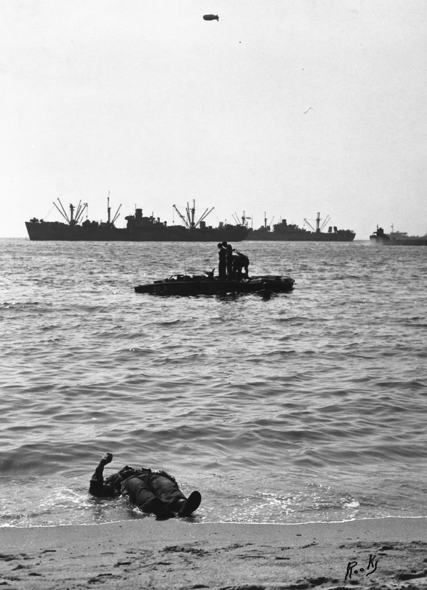 This image is part of my grandfather John Baker's "warbook" from World War II. The likely date of this image is August 15, 1944 according to notes written in the Warbook. According to the US Coast Guard ship history, the likely location for this is Baie de Cavalaire. This image was taken by Dale Rooks, as seen by his signature in the lower right. Dale Rooks and John Baker were both about the USS Duane, which was a Coast Guard cutter ship. View full size.