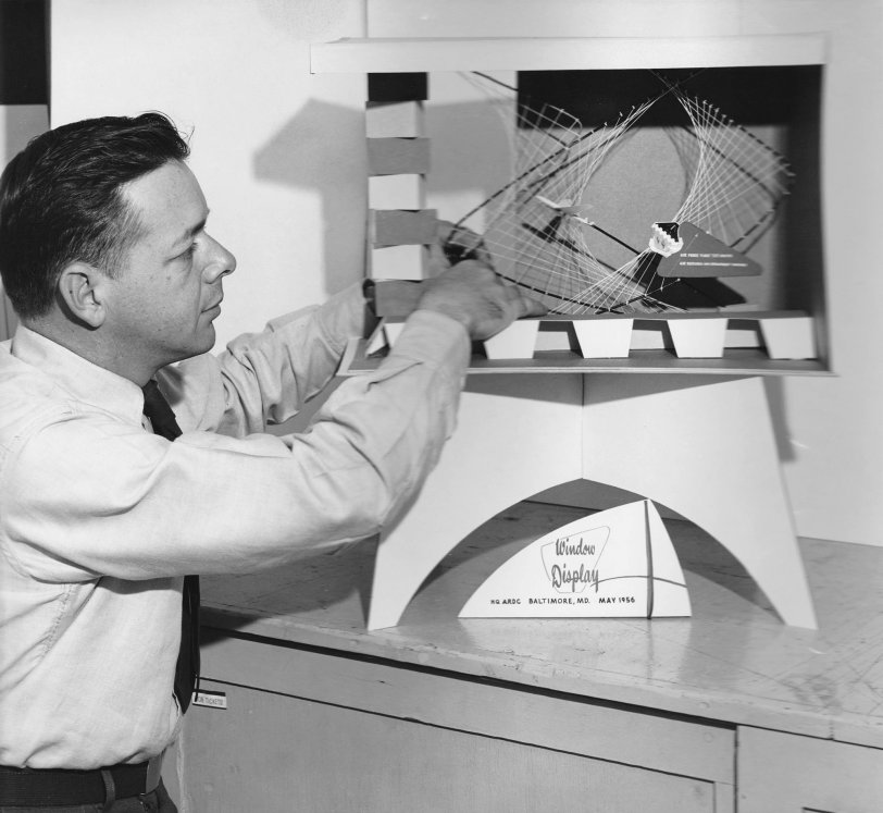 My Dad, Gordon Clevenger,at Edwards AFB, California, circa 1962, with one of his designs. He got his first job in a sign shop in Chicago, Illinois, as a young boy, and was still working as a "sign man" up until his death in 2002. He retired from the Air Force in 1963 after serving in WWII and Korea. View full size.
