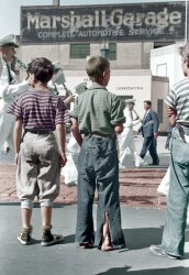 September 1939. Milwaukee, Wisconsin. "Boys watching Letter Carriers Convention Parade." Colorized version of 35mm nitrate negative by John Vachon. View full size.