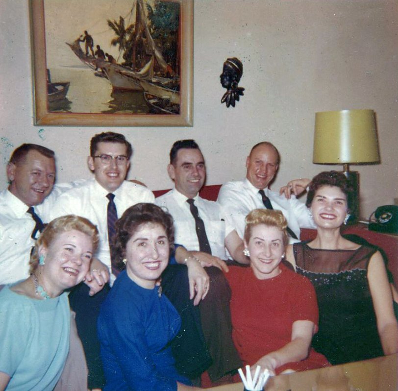 Unknown date, but likely early sixties. Yet another family or friends get-together with my grandparents, both of them on the far left. I love the hairstyles of the decade!  View full size.
