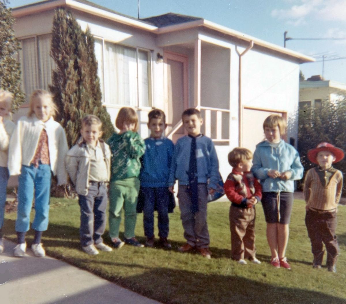 Charles M. Schulz knew what he was doing when he penned his "Peanuts" comic strip. Neighborhoods were full of little kids back in the '50s and '60s and this is just a part of our neighborhood kid population. I'm in the red, third from right and my older sister is second from right in the blue windbreaker and my other sister is in the green jacket. East Richmond Heights near San Francisco, 1966. View full size.
