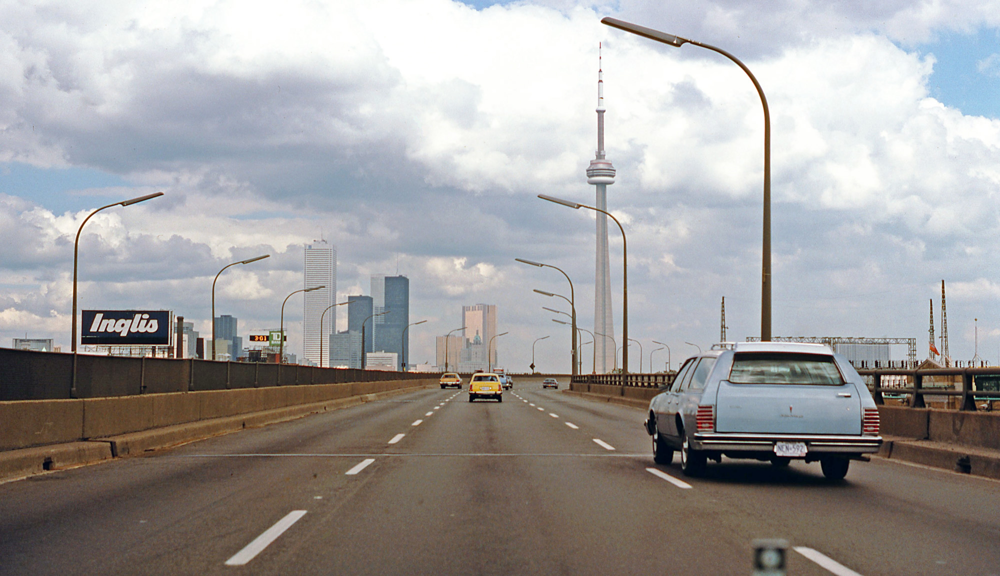 The last of three submissions on a trip to Toronto on the QEW, Labour Day 1979. Now I'm on the Gardiner Expressway, an elevated waterfront highway opened in the late 1950s. Downtown Toronto and the CN Tower are center of view, a scene that looks dramatically changed from this Gardiner view today. View full size.