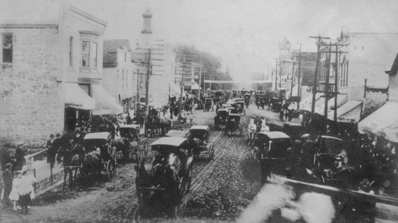 Image of a street in Rio Wisconsin during the Woodman Picnic, taken on June 12, 1907.
