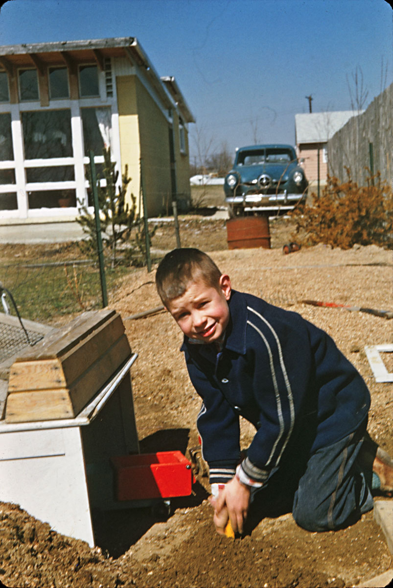 Take one kid, add dirt (water optional), and you have the very definition of "full of imaginative fun." Your 'umble narrator in the back yard garden, soon to learn a sharp lesson about leaving a rake with the tines up. Note the 1950 Studebaker Champion, AKA "The Green Apple." From my dad's slides: Kodachrome, Kodak Retina. View full size.