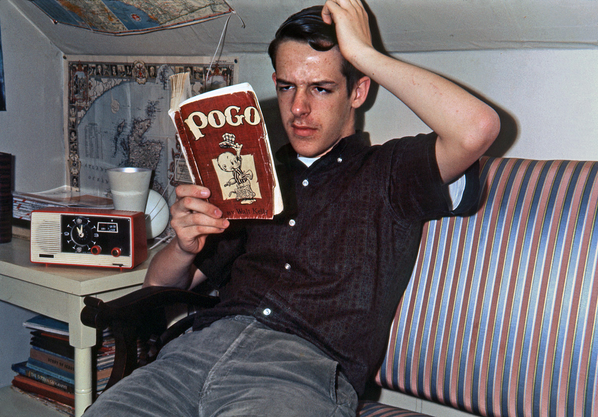 May 1963. This is a gag shot; the "gag," such as it is, being that I'm supposedly baffled by a comic strip character. I'd been a Pogo fan for as long as I could remember (note how worn that copy is) and by then I was, of course, well aware that Walt Kelly's strip had meanings on more than one level. I still have all our books, Dell comics and even the original "I Go Pogo" campaign button that I vaguely remember picking up at the San Francisco Chronicle building in 1952, when I was 6. But seriously, I posted this because of the nifty clock radio. And I want to assure all the Shorpy skeptics out there that, in the interests of historical authenticity, I did not Photoshop out any of my zits. Ektachrome-X slide.