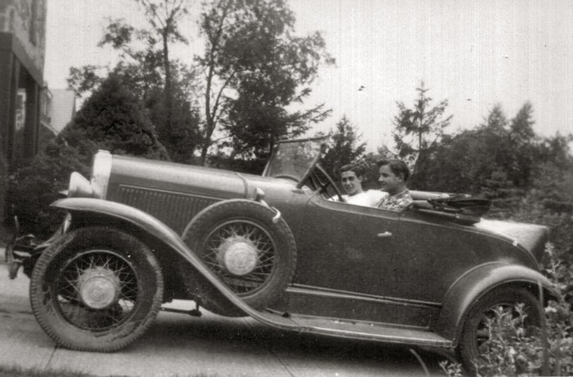 My father-in-law, Donald Johns, behind the wheel of his first car, a 1930 Pontiac roadster.  His friend Johnny Cuevas is riding shotgun. Taken in Manhasset, NY in the summer of 1944. Note the tilt-out windshield, rumble seat, original wood wheels on the rear, and replacement wire wheels on the front. The passenger side spare was a wood wheel. The car had been purchased that week for $30. View full size.

