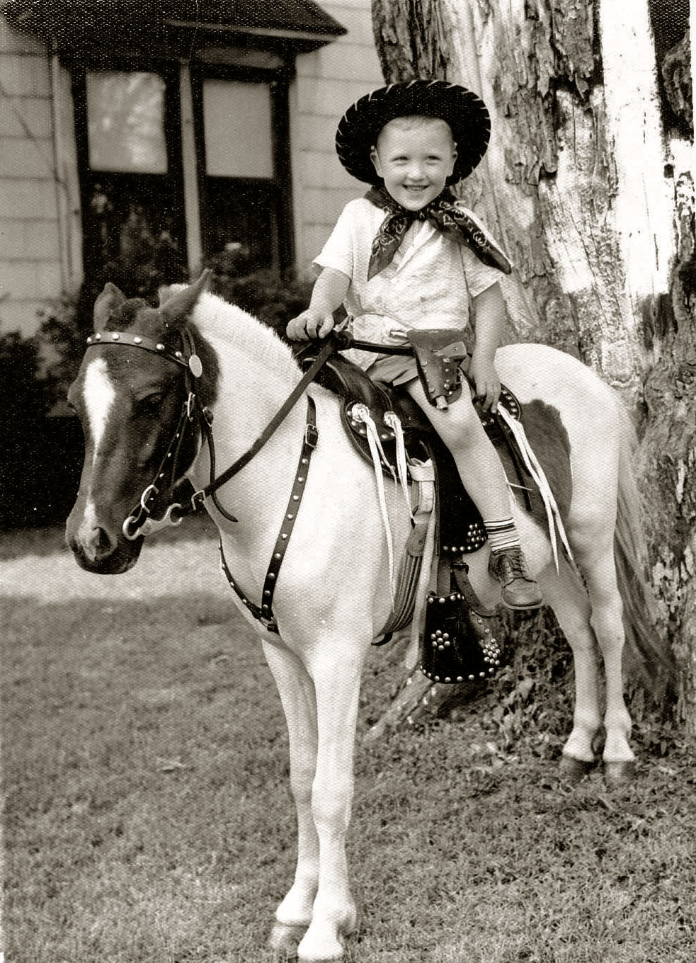 A typical kid picture from the 1950's, courtesy of a door-to-door photographer and his pony. In a few weeks he'd come back around with the finished pictures! View full size.