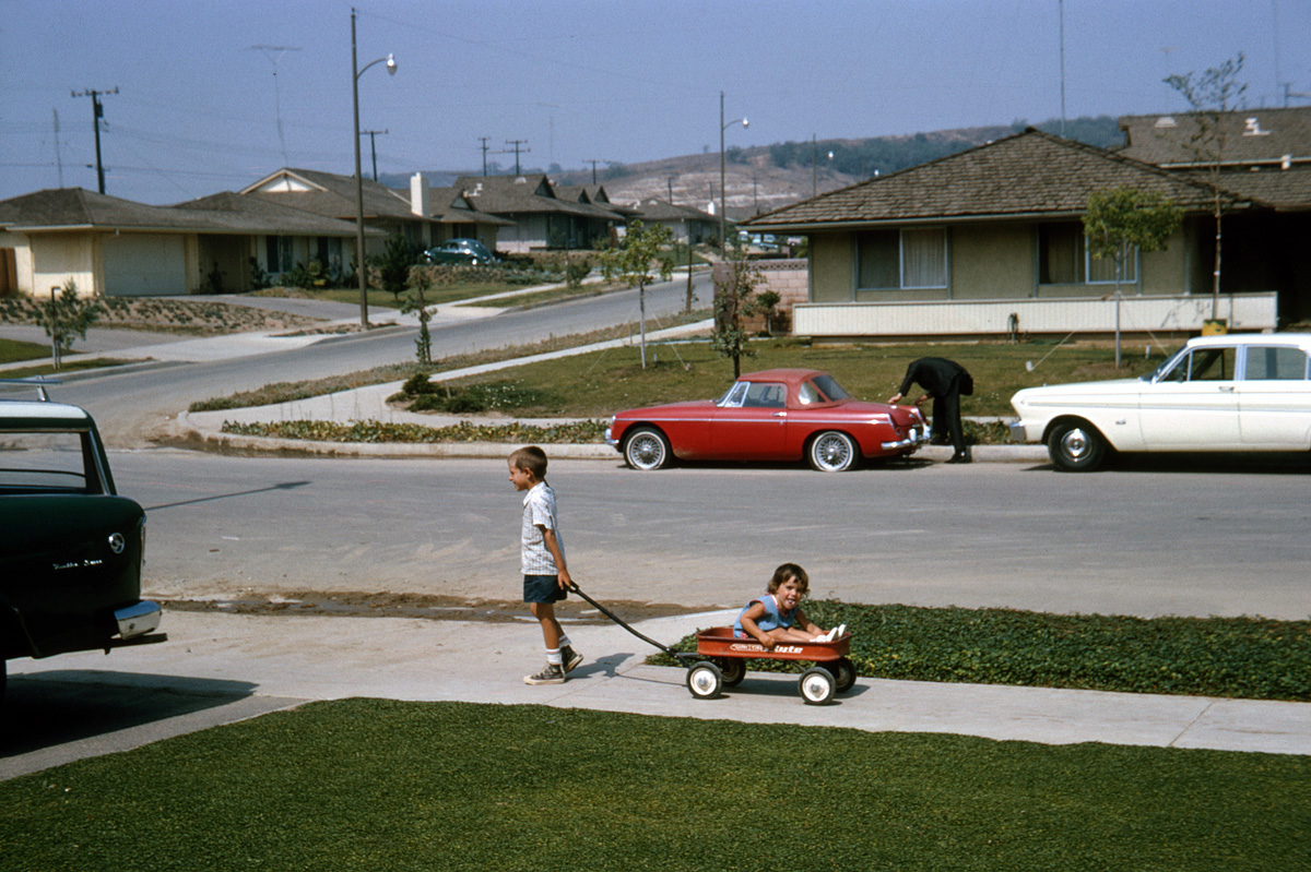 Diamond Bar, California, August 1965. The owner of the MG across the street isn't having quite as good a day as my niece and nephew. I shot this on 35mm Kodachrome. View full size.