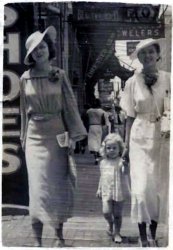 This picture is from the mid- to late- 1930's in downtown Birmingham Alabama. My grandmother is on the left.
High SocietyBoth these ladies are looking sharp, especially your grandmother. She gives off a classy Joan Bennett feel. It's hard to see the little girl, but I'm sure she's just as stylish.
Class!Man, when women of that era had class, they really had it! Great looking ladies!
(ShorpyBlog, Member Gallery)