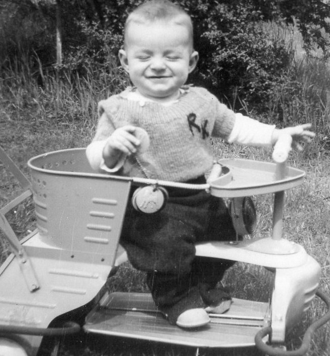 My husband as a baby in 1945 - check out the stroller!  In his backyard in Highland Park, CA.