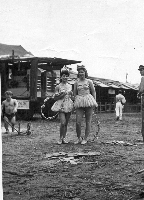 My Aunt Claire took this picture of her friends who where dancers with the Ringling Bros. Circus in 1941. That is the generator in the background. You can also see a couple roustabouts and a muscular little person.
