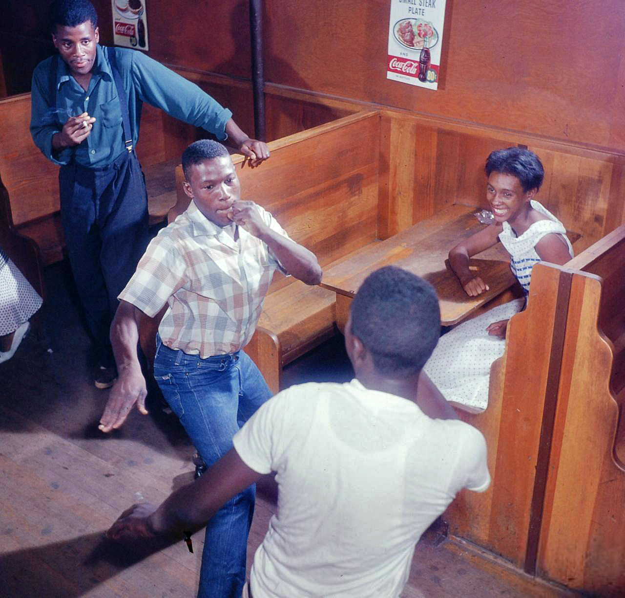 More from the South Carolina roadhouse. So far I've found five pictures of these two mixing it up, either wrestling or dancing. The captions don't say anything about what's going on, but the girl seems delighted. Color transparency by Margaret Bourke-White, Life magazine image archive. View full size.