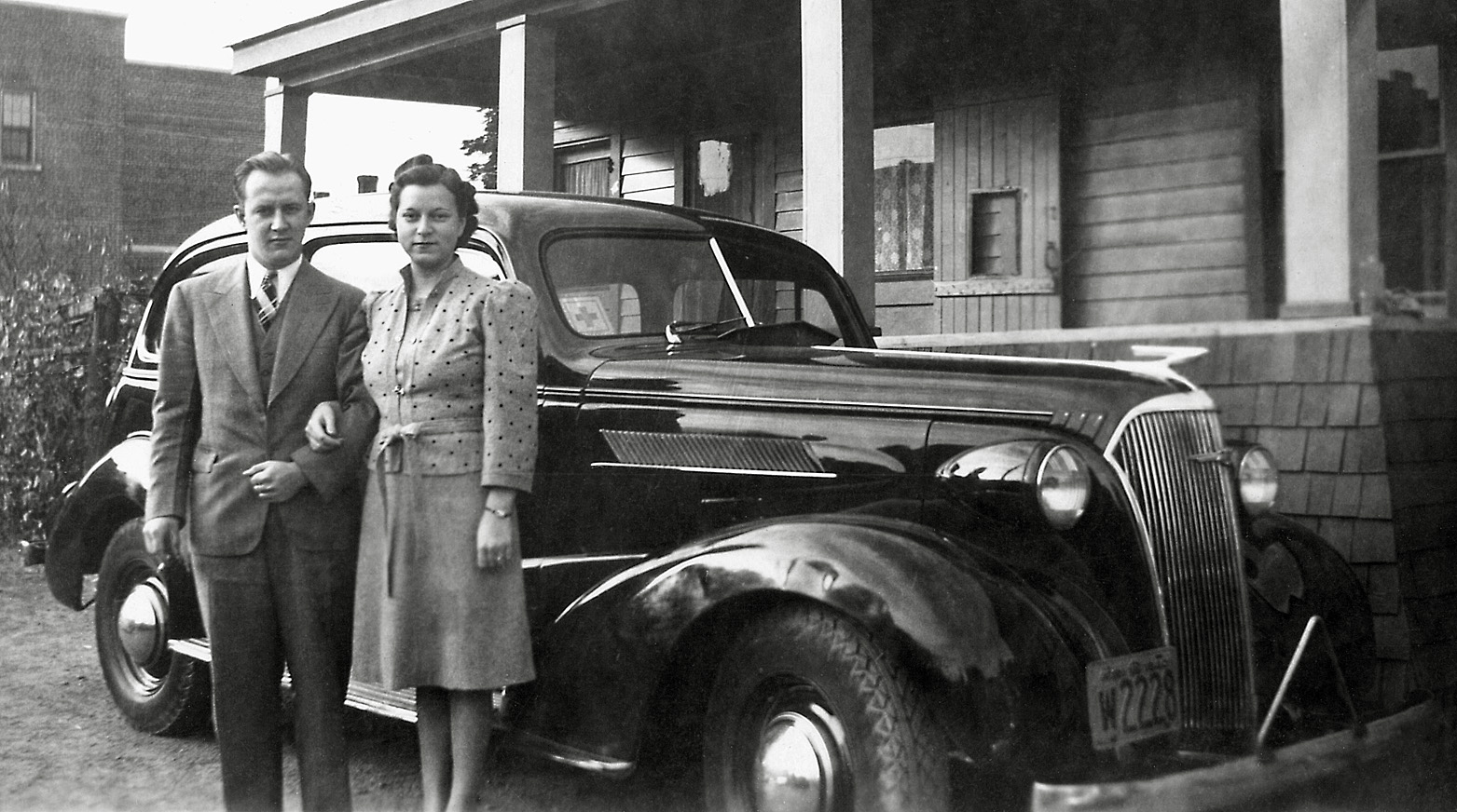 This is my mom and dad just after their marriage in 1941, taken at their close friends' home in Thorold, Ontario, located on a lane up a hill behind the post office on Main Street. Dad's first car which he had just purchased is that 1937 Chevy. View full size.