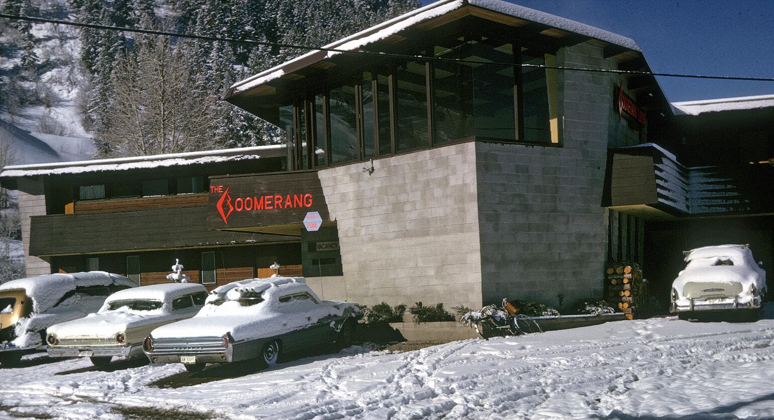 Winter 1962-63 in Aspen, Colorado. Boomerang Lodge, designed by owner Charlie Paterson, a Frank Lloyd Wright-trained architect (and ski instructor). The vehicle on the left is a Cadillac hearse used as a lodge limo! View full size.