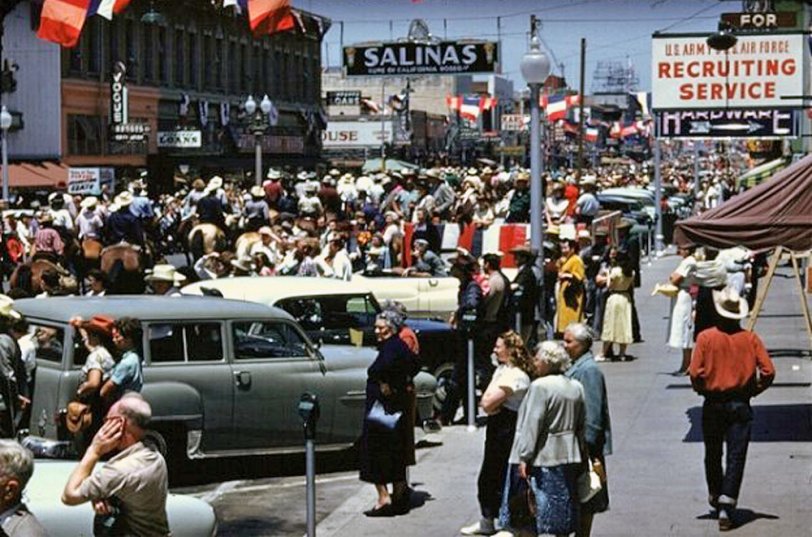Downtown Salinas, California, July in the 1950s (July). Main Street in "Big Week," meaning the Rodeo was in town. View full size.
