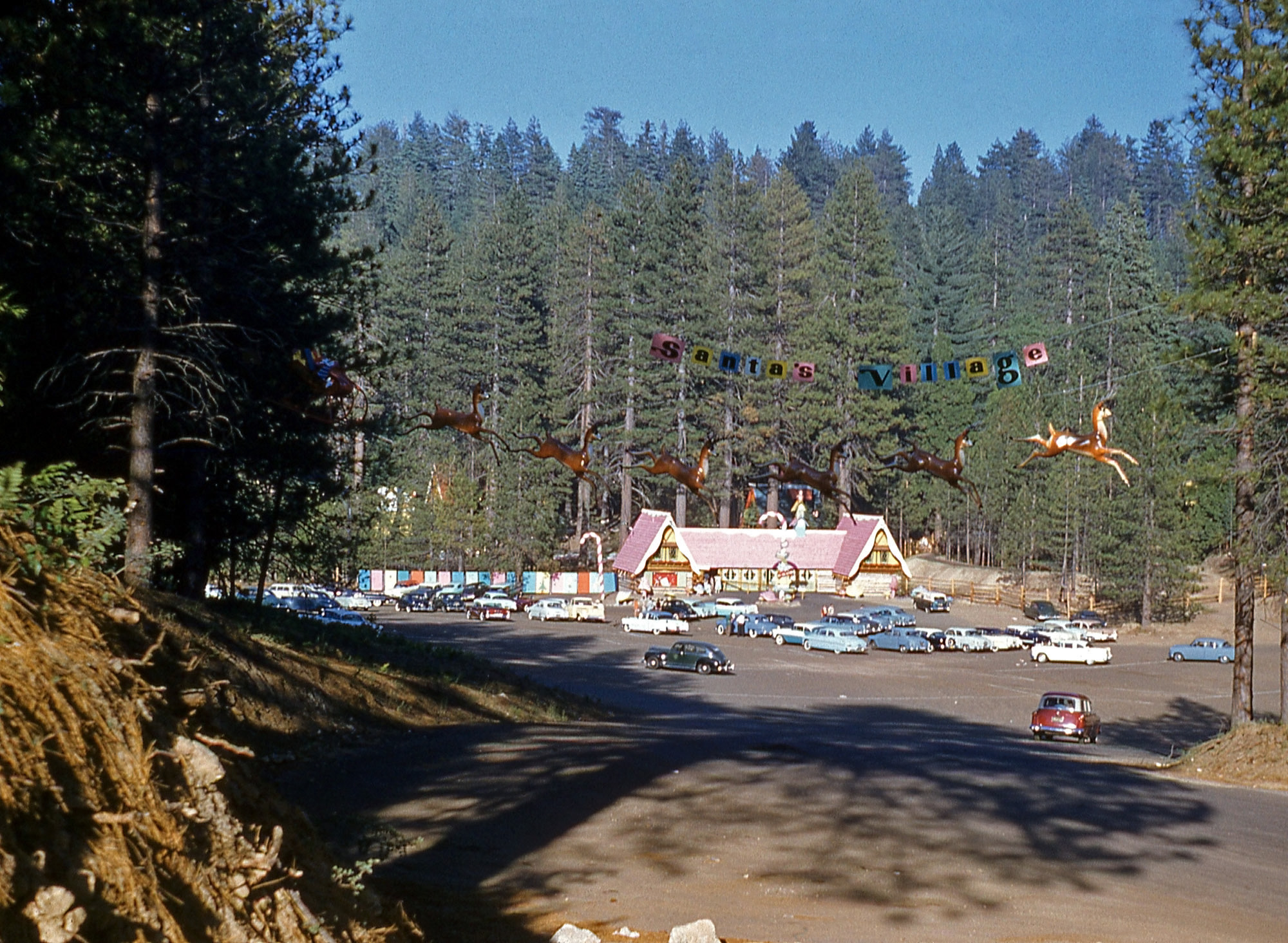 Santa's Village at Lake Arrowhead in Southern California in a Kodachrome slide I found in a thrift store. The park opened in 1955, and I don't see any 1957 model cars, so the date is my best guess. View full size.