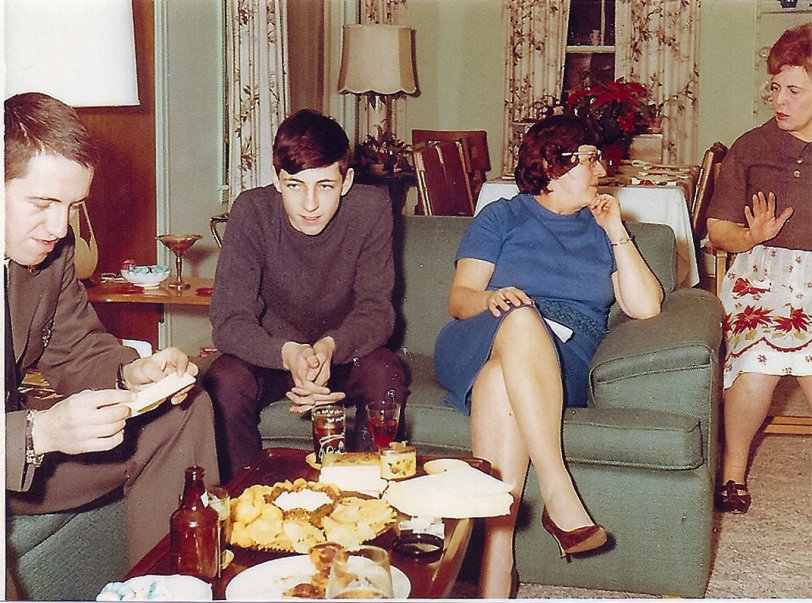 My Mother, Brother and I visiting my Aunt at her home in January of 1967. I'm on the left side of the photo. I had just completed boot camp at Fort Dix, and was on my way to Fort Gordon for training in radio-teletype. Then heading over to Nurnberg, Germany. My Aunt Jeanette is on the right. And she's wearing her holiday apron. Mom is the second from the right. This was in Buffalo, New York. View full size.
