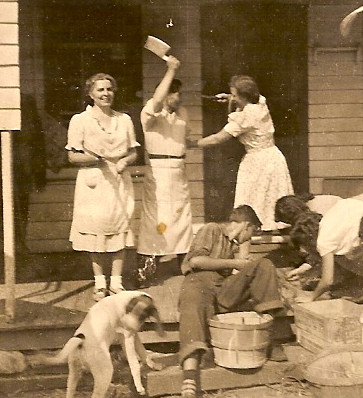 This is a photo of my grandmother Manola Valcarcel, and the boarding house cook and chamber maid (having some fun).  It was  taken in the mid-forties (approx. 1945). They were taking a break from working in the kitchen at my grandfather's boarding house in Mt. Tremper (located nearby Woodstock, New York).  My father, mother and her sister are on the porch steps.

