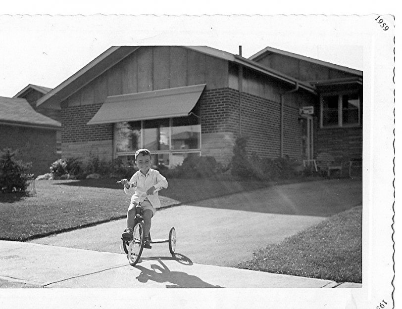 Me at age 4 on my tricycle in front of the house I grew up in, in Scarborough, Ontario in the summer of 1959. View full size.
