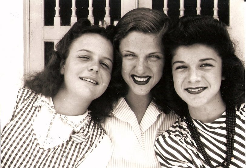 This picture was taken in the early forties in Miami. The three pretty gals from left to right are Nancy, Ann, and Helen Spach. Ann is the oldest, Nancy is the youngest and the only one not wearing lipstick. They sure are cute! View full size.
