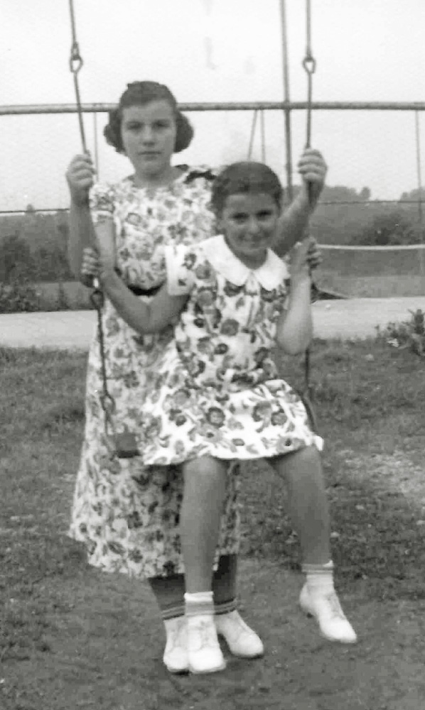 Possibly on the same swing set that their parents posed with when dating, my then-seven-year-old future mother and her older sister Harriet pose for their parents and a photograph. 
