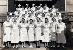 These are some of the gals of Swift and Co. factory workers. The picture was taken in the late fifties or early sixties at the Swift and Co.'s meat packing plant in East St. Louis. My great-grandma Josie is in there somewhere. She worked as a hot dog stuffer. View full size.
An error in dateI was looking at some more of my grandma Josie's picture and happen along "The Swift Arrow" newspaper (Swift and Co.'s company newpaper) from September 1939, and in that edition was the same exact photo as the one above. So I was about a decade or two off when I said this photo was from the early fifties or sixties, it in fact, was from 1939. The article under the picture says that these girls work in the sausage kitchen, and it lists all their names and the places they come from. Many of them are from East St. Louis where the factory is but many are also from, Hungry (the article lists it as Hungaria), Austria, Germany, and Poland. My grandma Josie moved to E. St. Louis from New Waverly, TX, (where she was born,) though her parents and husband were both from Poland.
[Shorpytip #856: Registered users can change their photo captions at any time by clicking the "Edit" tab. - Dave]
(ShorpyBlog, Member Gallery)