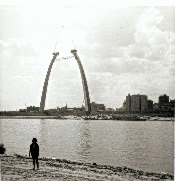 This was taken in August of 1965; as you can see in the background the St. Louis Arch is being build. I got this picture from my great Aunt Regina's scrap book. She lived in East St. Louis; the girl in the picture is my mom. View full size.