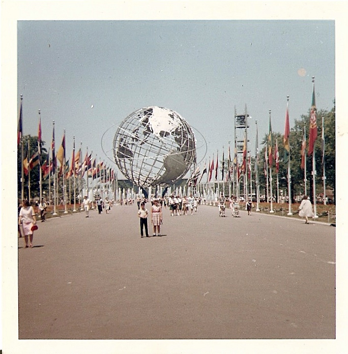 This is a picture of my mom and her brother at the New York World's Fair. I guess my grandma wanted to get the at much as she could in the photo so my mom and uncle are really far away, but you can see my mom's pretty plaid dress. My grandpa worked for the airlines in Miami, Fla.,  the now defunct Eastern Airlines. So they were able to get cheap tickets up to New York. When talking about the Fair my mom always mentions seeing the talking Abraham Lincoln robot. View full size.