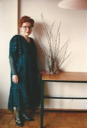My mother poses in a dress she designed and made, next to an end table that I made for her in high school shop class, with an arrangement of pussy willows on it. As usual, she is documenting her sewing. Until I started selecting photos from my family albums, I never realized just how much of our family photos were not the usual events, holidays, and vacations in most family albums, but a portfolio of clothes she designed and made.