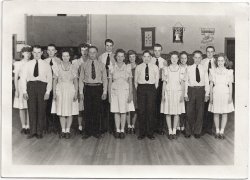 The first girl from the right in the back row is my mother and the first from the right in front is her cousin. All of the kids were from in and around Walla Walla, Washington. I love this picture, from a time when kids did productive things to entertain themselves and took pride in knowing those who were serving our country. View full size.
Square dancersYour mother and her cousin obviously carried the same pretty-girl gene; they could be sisters. Tall guy in back later moved to Metropolis and went into the journalism racket, part-time.
Pride in good groomingThese youngsters were so well-dressed, combed and shiny that I first thought this was a graduation picture. I think so much of our self-respect is reflected in our personal appearance and the Walla Walla teens seem to have a very healthy attitude.   I particularly like the beaming, proud look on the face of the boy in the front row who has an elaborate tie clip (with a hanging chain and monogram) and I would bet he had a very successful future ahead of him. This group represents the results of excellent parenting and depicts "wholesomeness" at its finest.  Very refreshing.
(ShorpyBlog, Member Gallery)