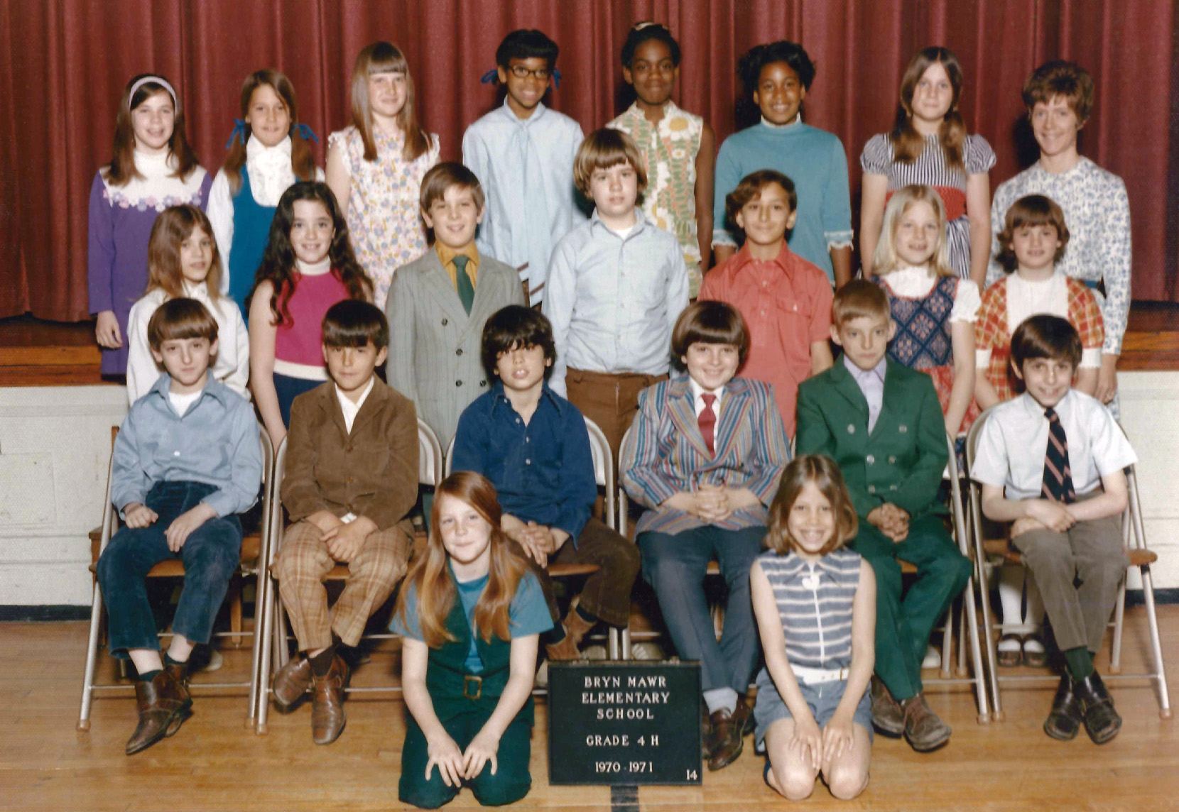 After three years of sitting on the floor, by the sign, my brother Iden moves up to the far left chair in the first row in his 1971 fourth grade school picture. View full size.