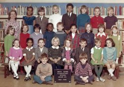 My brother Iden sits on the right side of the sign for his second grade class picture in 1969. View full size.