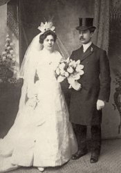 My mother’s Uncle Benny and his wife pose for an official wedding portrait at an unknown date during the late 1800s or early 1900s at Hurwitz’s Photographic Art Studio, 273 E Houston St., New York City. At some point Benny sent for his younger brother Issar to join him in America. Together they formed the Weinstein Brothers Cloak and Suits. Unknown how they became the Weinstein Brothers because they were born with the last name of Derrish. View full size.
(ShorpyBlog, Member Gallery)