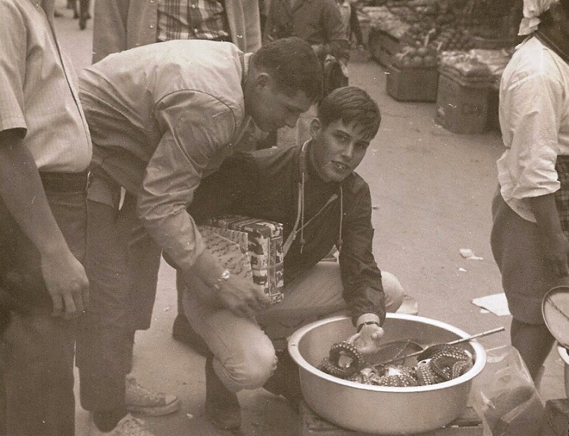 Bill Karst and I checking out the wares in what was called "black market alley". Naha City, Okinawa c.1969
