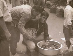 Bill Karst and I checking out the wares in what was called "black market alley". Naha City, Okinawa c.1969
Went there, did thatI was at Naha Air Base, Okinawa, during 69-70, in the 21st Tactical Airlift Squadron. Poked around a lot of markets and visited Suicide Cliff and lots of old Japanese army caves. Returned during 76-77, after reversion to Japanese government control, and everyone was driving on the other side of the street and using yen! A hot and damp island with lots of opportunity for scuba and snorkeling. Typhoons will get your attention as well.
(ShorpyBlog, Member Gallery)