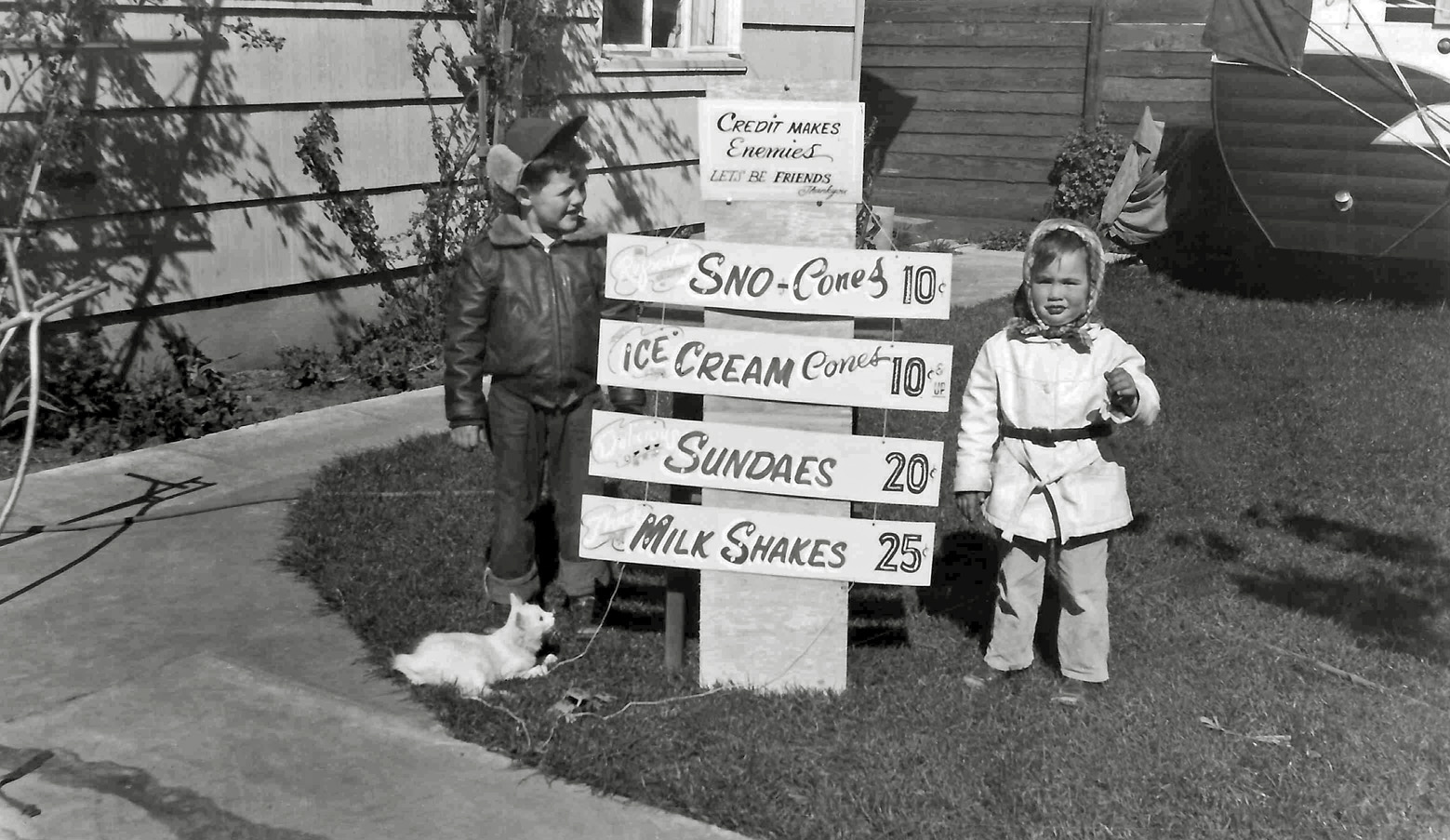 Family photo with new sign. Winter 1955 in Vallejo, California. The sign was created by my grandfather. View full size.