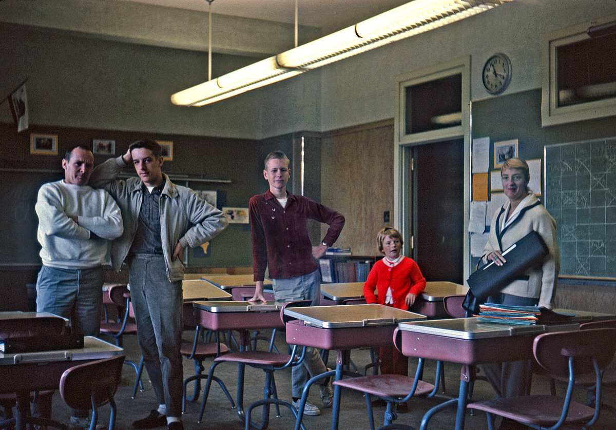 December 1962. I'm a junior in high school, and during Christmas break a chum and I revisit the grade school we graduated from two and a half years earlier. Lo and behold, there we find, in our old classroom, our eighth grade teacher, in mufti, along with his wife and daughter. "With a little more effort and attentiveness, Paul can accomplish much more than he presently is," is what he'd written on my report card in 1960. Man, did he have me figured. Check out my then-de rigueur white-socks-with-black-loafers and semi-peg pants. I was bound and determined to at least not dress like a dork. Self-timer Kodachrome with my new Kodak Retinette 1A. View full size.