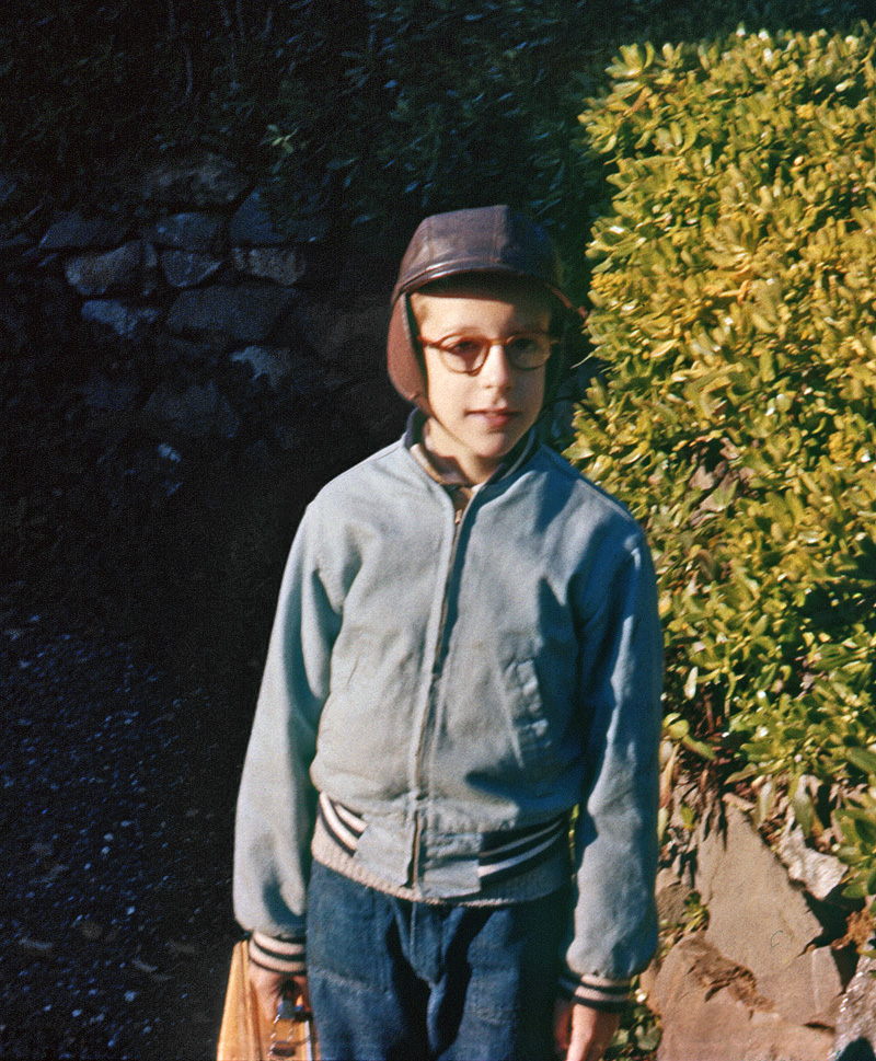 My mother made darned sure I was bundled up enough for this (presumably) chilly late winter morning in early 1955. My brother shot this on Ektachrome in our front yard as I was about to set off on my 5 block walk to my third grade class at Larkspur-Corte Madera School. I can't remember what the theme of my lunchbox was. It was either "weapon against bullies on my way home" or "please don't let my Thermos break again." View full size. Later on: This and That.