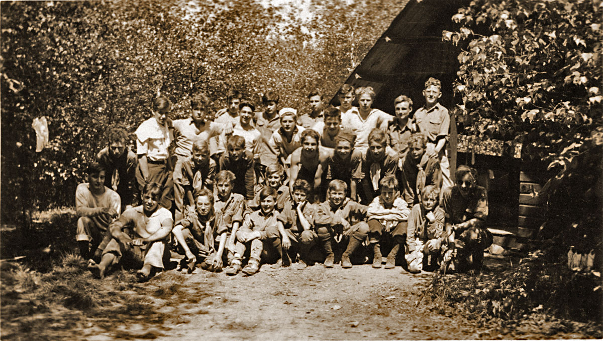 This is my father's scout troop at "Scout Acres," in Boonton, N.J., May 28-31, 1937
     Rear: Bob Altrath, Bill Hand, Ray Mulford, Jack McCleve, Bob Teshima, Russell Herold, Mr. Donald Wild, Chas Miller (apparently, the last four have no names, or don't really exist...)
     Center: Arthur Lautz, Bob Eisele, Herbert Walker, Ronald Borx (?), Clinton Laux, Bill Bennett, George Meierdieck.
     Bottom: Edward Ryniewicz, Bob Shantz, Ray Phipps, Bob Schickel, George Kalmbach, Fred Schroeder, Roy Bellamy, Paul Podkowa, Kenneth Vital, Wilbur Meirdeick, Paul Reiman.
     Not big on uniforms... View full size