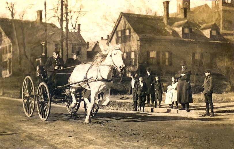 This on says Sumner Square (or street) Boston 05 on the back. Looks to be fire or policeman at the reins, and in a hurry.