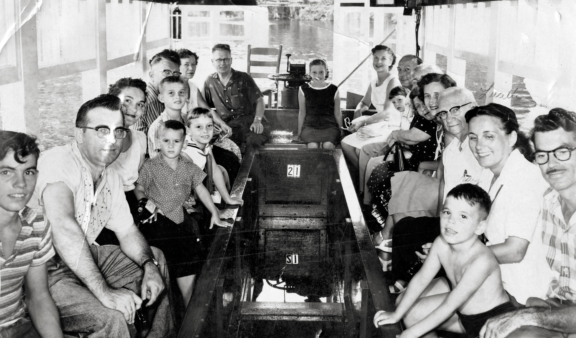 A ride on a glass-bottom boat, Silver Springs State Park, Florida, 1958. I'm on the right sitting between my mom and dad, my older brother at the far left. This is a souvenir photo that was made available for purchase. Later that week my dad splurged on a roll of Kodacolor for our visit to Cypress Gardens. View full size.